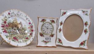 A Royal albert 'Old Country Roses' mantel clock, wall clock and picture frame.