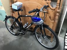 A Raleigh explore bicycle with helmet,