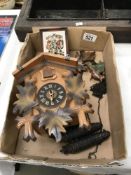 A Hummel wall clock and a Black Forest cuckoo clock (no pendulums)