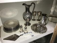 A shelf of silver plate including ewer tankard etc.