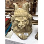 A sandstone garden ornament of a gargoyle