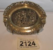 An Embossed Dutch silver ashtray. Approximately 49 grams.