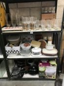 3 shelves of kitchen items and glassware