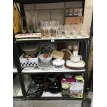 3 shelves of kitchen items and glassware