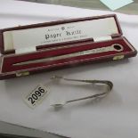 A cased silver paper knife and a Chester hall marked pair of sugar nips.