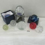 A quantity of glass paperweights.