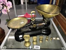 A vintage set of Libra weighing scales with a set of 6 graduated bell weights