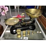 A vintage set of Libra weighing scales with a set of 6 graduated bell weights