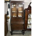 An oak bureau bookcase