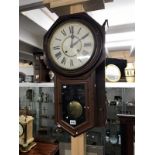 An American Ansonia clock company wall clock with pendulum