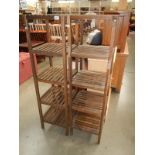 A pair of slatted wood bathroom shelves