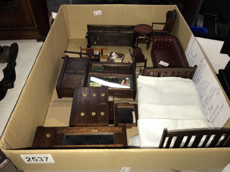 A quantity of wood and leather dolls house furniture including reclining chair, Chesterfield,