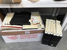 A box of cased tape to tape reels