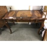 An ecclesiastical table inlaid with religious figures