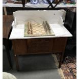 An Edwardian oak marble top washstand