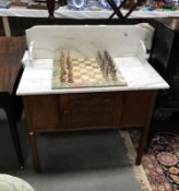 An Edwardian oak marble top washstand