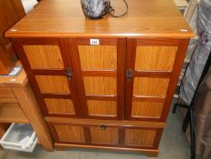 A teak effect cupboard