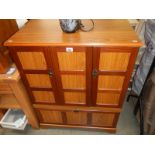 A teak effect cupboard