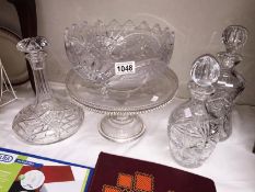 3 good decanters (1 stopper A/F) and a large cake stand and decorative glass fruit bowl