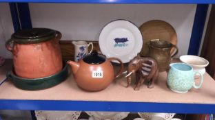 A mixed lot including terracotta lidded pot, teapot, jugs etc.