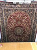 A red ground Keshan carpet 230 x 160cm