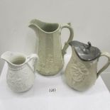 A Victorian jug with pewter lid and 2 others.