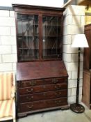 A mahogany bureau bookcase