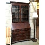 A mahogany bureau bookcase