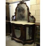 A Victorian mahogany mirror back credenza with marble top, carvings of berries and leaves,