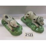 A pair of Staffordshire pottery hounds (possibly Samson).