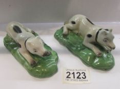 A pair of Staffordshire pottery hounds (possibly Samson).