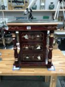 A red lacquered 3 drawer side cabinet with glass top