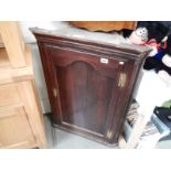 A Victorian oak corner cupboard