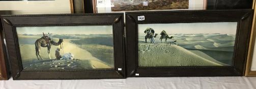 A pair of Arabic desert landscape prints in oak frames