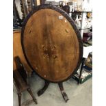 A mahogany inlaid tip top loo table