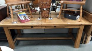 A large modern solid oak farm house draw leaf table