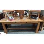 A large modern solid oak farm house draw leaf table