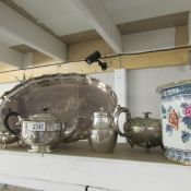 A mixed lot of silver plate including gallery tray, teapots etc.