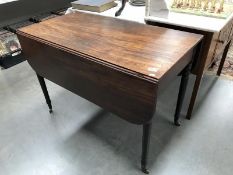 A drop leaf table on wheels