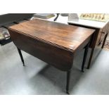 A drop leaf table on wheels