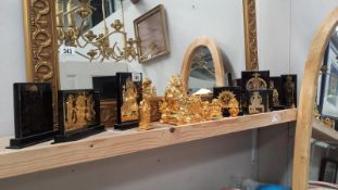 A collection of Indian god figurines and plaques