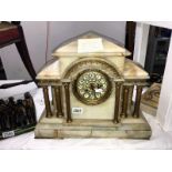 An onyx and brass mantel clock (a/f loose brass and onyx panels)