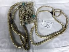 A pearl necklace with silver clasp,