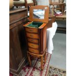 An ornate floor standing 4 drawer jewellery cabinet