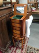 An ornate floor standing 4 drawer jewellery cabinet