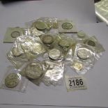A mixed lot of UK silver coins including Victoria, George V etc.