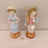 A pair of continental porcelain figures.