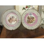 2 unmarked cabinet ribbon plates featuring cherubs