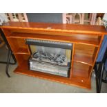 A 1970's coal effect electric fire with surround