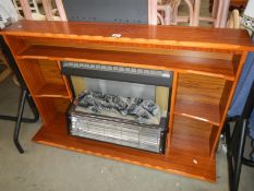 A 1970's coal effect electric fire with surround